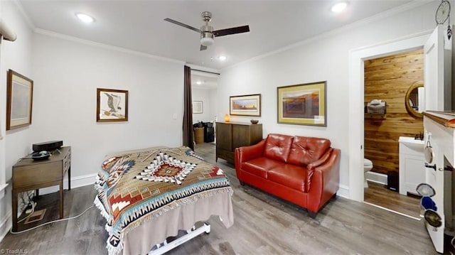 bedroom featuring hardwood / wood-style floors, ceiling fan, and ornamental molding