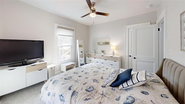 carpeted bedroom featuring ceiling fan