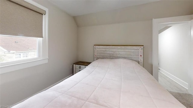 bedroom with vaulted ceiling