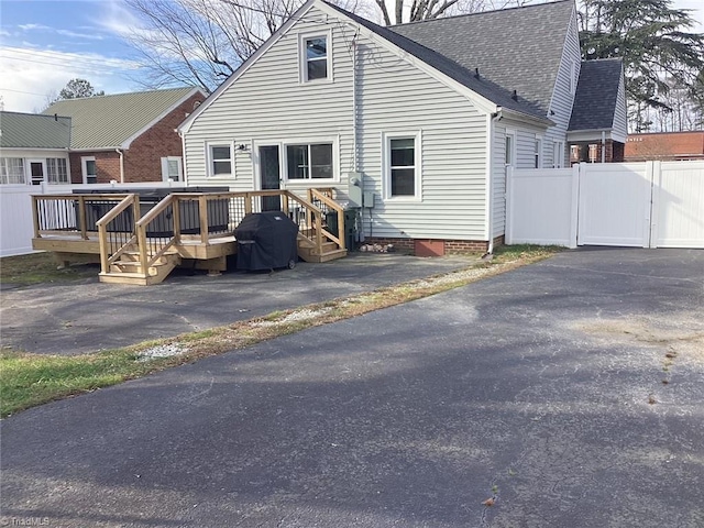 rear view of property with a deck