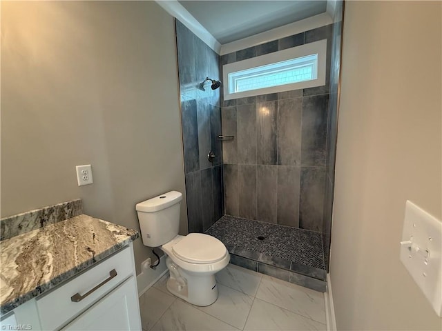 3048 Island Dr, Northtopsail Beach, NC 28460 - full bathroom featuring marble finish floor, baseboards, a tile shower, and toilet