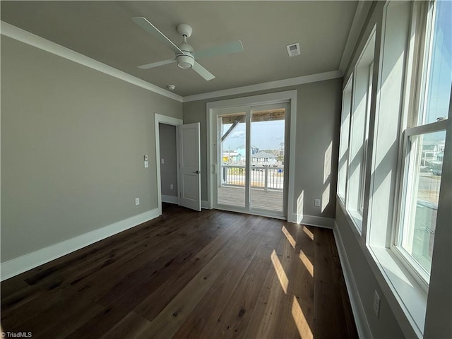 3048 Island Dr, Northtopsail Beach, NC 28460 - unfurnished room featuring dark wood finished floors, baseboards, visible vents, and crown molding