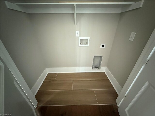 3048 Island Dr, Northtopsail Beach, NC 28460 - laundry room featuring hookup for an electric dryer, washer hookup, baseboards, laundry area, and wood tiled floor