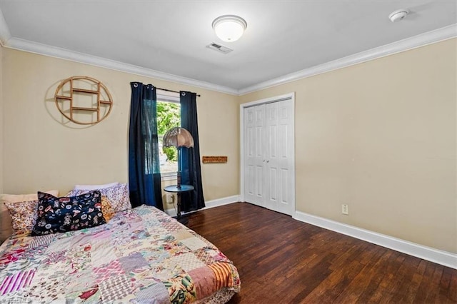 3941 Vest Mill Rd, Winston-Salem, NC 27103 - bedroom with wood finished floors, baseboards, ornamental molding, and a closet