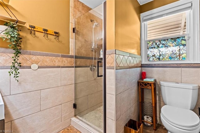 3941 Vest Mill Rd, Winston-Salem, NC 27103 - full bath featuring tile walls, a shower stall, toilet, and a wainscoted wall