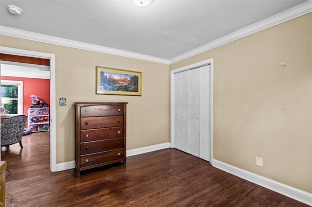 3941 Vest Mill Rd, Winston-Salem, NC 27103 - bedroom with baseboards, wood finished floors, ornamental molding, and a closet