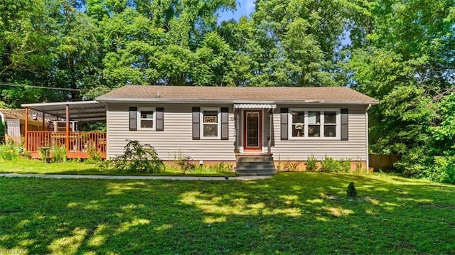 3941 Vest Mill Rd, Winston-Salem, NC 27103 - view of front of home featuring a carport, a front lawn, and a wooden deck