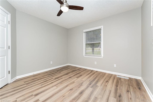 4104 Old Greensboro Rd, Winston-Salem, NC 27101 - empty room with wood finished floors, ceiling fan, a textured ceiling, and baseboards
