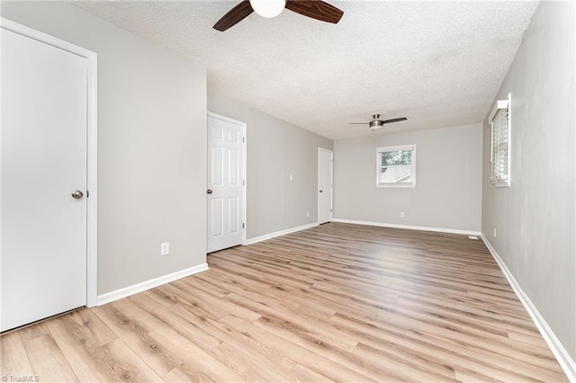 4104 Old Greensboro Rd, Winston-Salem, NC 27101 - empty room featuring ceiling fan, a textured ceiling, light wood finished floors, and baseboards