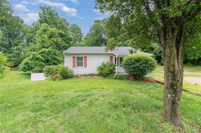 4104 Old Greensboro Rd, Winston-Salem, NC 27101 - view of front of home with a front lawn and a chimney