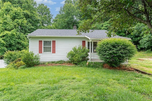 4104 Old Greensboro Rd, Winston-Salem, NC 27101 - view of front facade featuring a front yard and a chimney