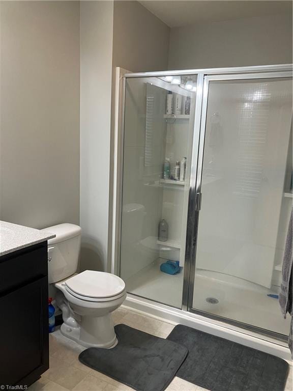 5304 Smoky Ridge Ln, Winston-Salem, NC 27127 - bathroom with toilet, a stall shower, vanity, and tile patterned flooring