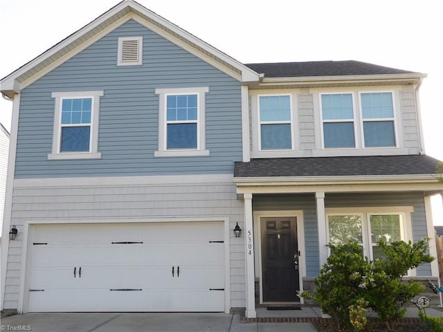 5304 Smoky Ridge Ln, Winston-Salem, NC 27127 - traditional home with an attached garage, driveway, roof with shingles, and a porch
