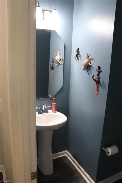 5304 Smoky Ridge Ln, Winston-Salem, NC 27127 - bathroom with baseboards and wood finished floors