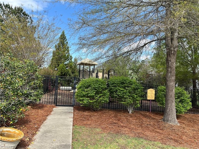 view of gate featuring fence