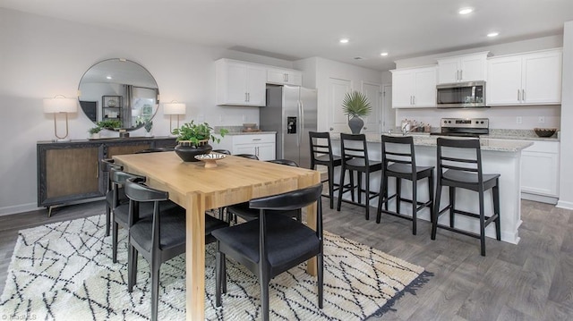 2124 Monk Dr, Haw River, NC 27258 - dining room featuring recessed lighting, wood finished floors, and baseboards