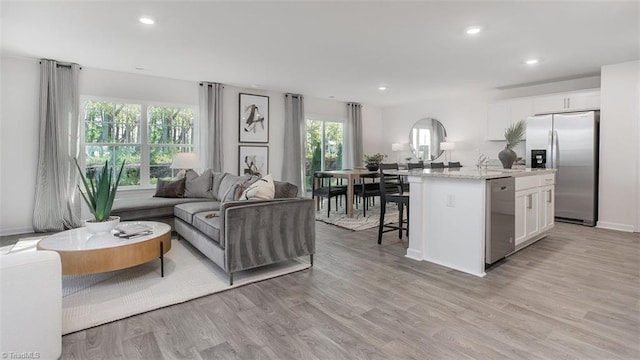 2124 Monk Dr, Haw River, NC 27258 - living area with light wood-style floors, recessed lighting, and baseboards