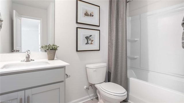 full bathroom featuring vanity, shower / bath combination with curtain, toilet, and baseboards