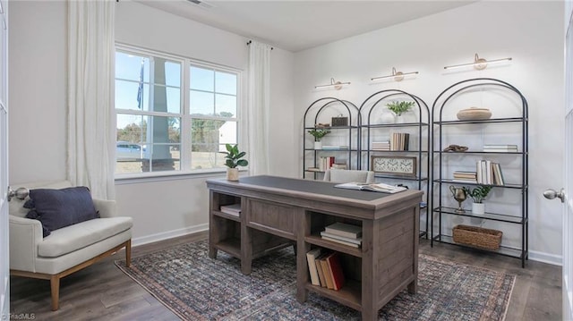 office space with dark wood-type flooring and baseboards