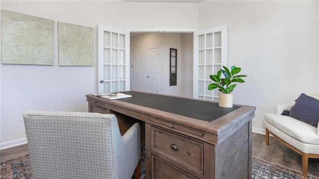 office space with dark wood-style floors and baseboards