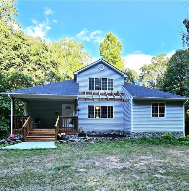 exterior space featuring a pergola, a lawn, and a deck