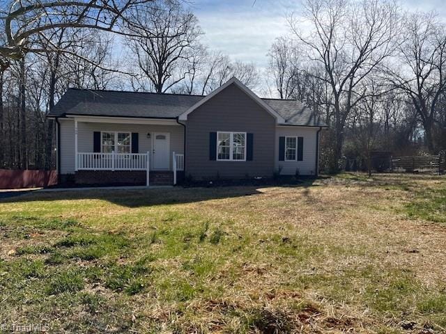 single story home with a porch and a front lawn