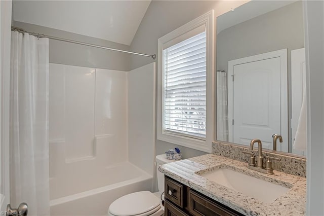 full bathroom featuring vanity, shower / tub combo, vaulted ceiling, and toilet