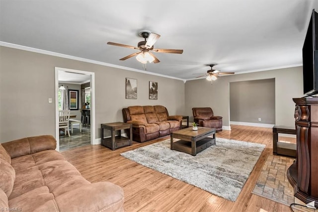 407 Pinedale Dr, Reidsville, NC 27320 - living area with a ceiling fan, ornamental molding, and light wood-style flooring