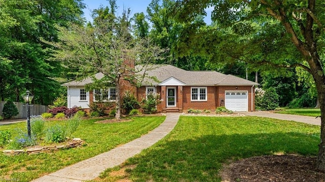 407 Pinedale Dr, Reidsville, NC 27320 - ranch-style home featuring an attached garage, driveway, a chimney, and brick siding