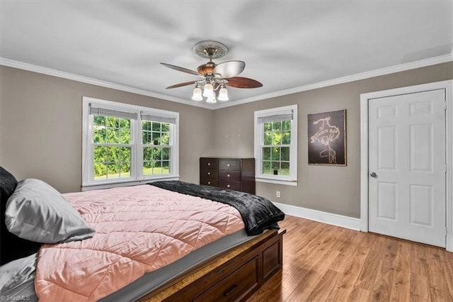 407 Pinedale Dr, Reidsville, NC 27320 - bedroom with light wood-style floors, ornamental molding, and ceiling fan