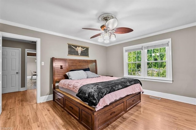 407 Pinedale Dr, Reidsville, NC 27320 - bedroom featuring light wood finished floors, ornamental molding, and ceiling fan