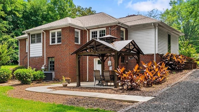 407 Pinedale Dr, Reidsville, NC 27320 - view of front of house with brick siding, a gazebo, and a patio