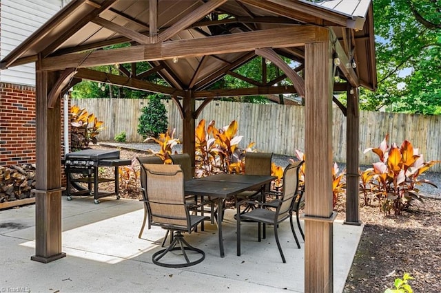 407 Pinedale Dr, Reidsville, NC 27320 - fenced backyard with a gazebo, outdoor dining space, and a patio