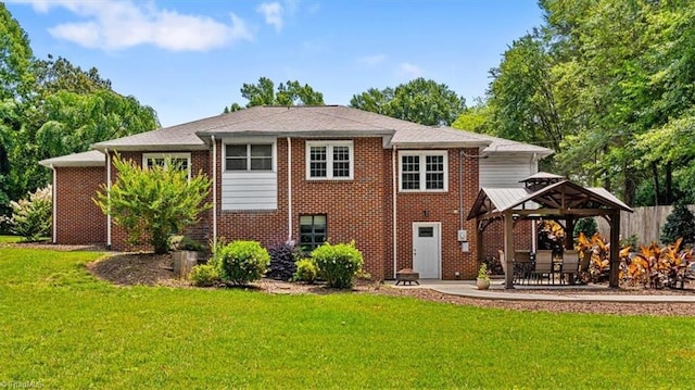 407 Pinedale Dr, Reidsville, NC 27320 - rear view of house featuring a gazebo, brick siding, a lawn, and a patio