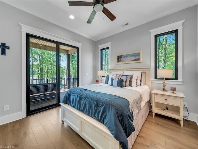 1579 Sunset Pointe Dr, Salisbury, NC 28146 - bedroom featuring access to outside, multiple windows, and light wood-style flooring