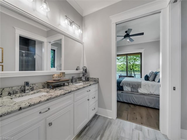 1579 Sunset Pointe Dr, Salisbury, NC 28146 - ensuite bathroom with a sink, double vanity, baseboards, a ceiling fan, and connected bathroom