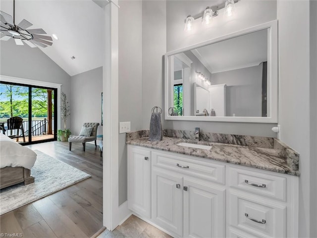 1579 Sunset Pointe Dr, Salisbury, NC 28146 - bathroom with vaulted ceiling, a ceiling fan, wood finished floors, ensuite bathroom, and vanity