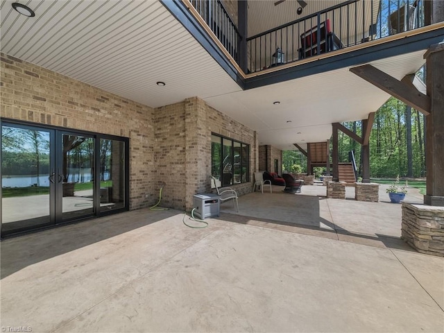 1579 Sunset Pointe Dr, Salisbury, NC 28146 - view of patio with french doors, stairs, and a water view