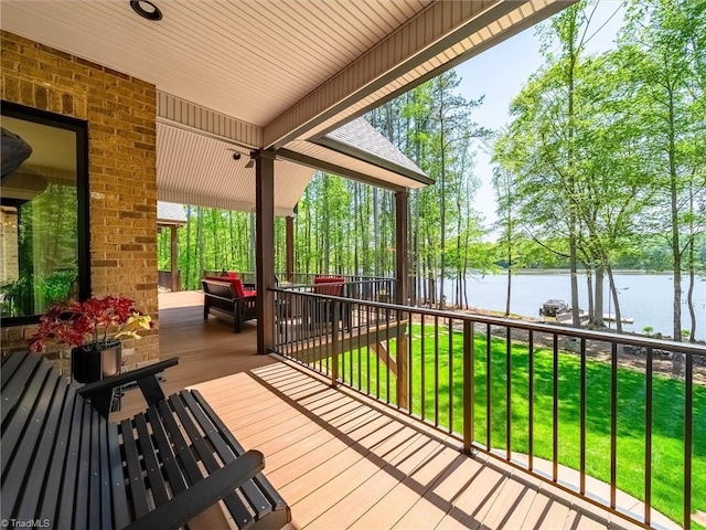 1579 Sunset Pointe Dr, Salisbury, NC 28146 - wooden deck with a yard, a water view, and fence
