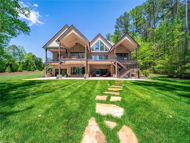 1579 Sunset Pointe Dr, Salisbury, NC 28146 - rear view of house with brick siding, a yard, a ceiling fan, and a patio