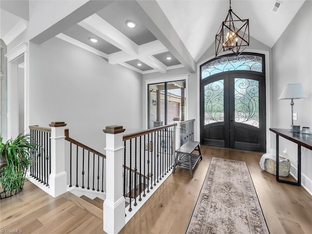 1579 Sunset Pointe Dr, Salisbury, NC 28146 - entryway with french doors, beam ceiling, visible vents, an inviting chandelier, and wood-type flooring