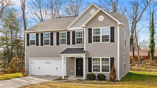 view of front of home with driveway and an attached garage