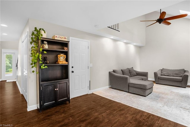 living area featuring dark wood-style floors, ceiling fan, baseboards, and recessed lighting