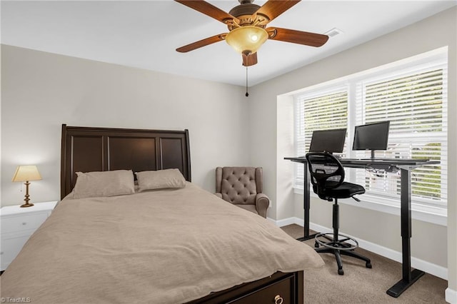 carpeted bedroom with baseboards and a ceiling fan