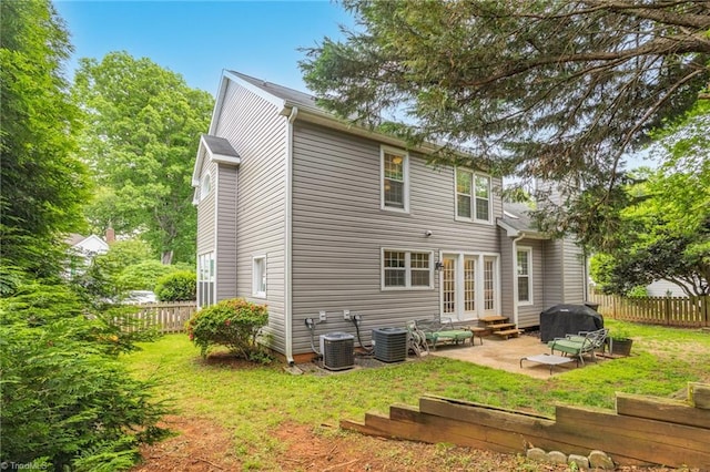 back of house featuring a patio, entry steps, central AC unit, and french doors