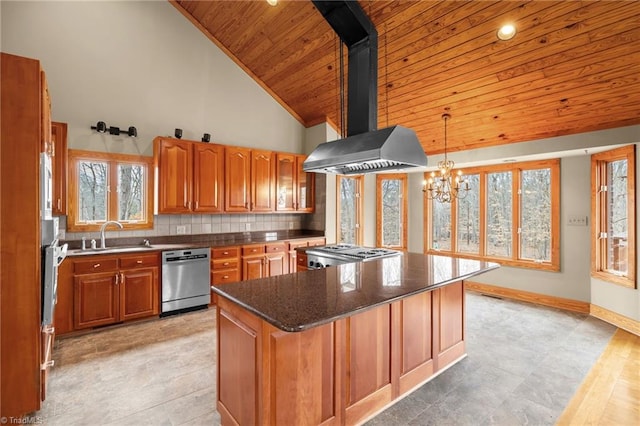 kitchen featuring sink, a center island, hanging light fixtures, dishwasher, and wall chimney range hood