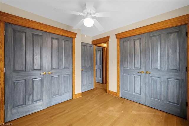 unfurnished bedroom with ceiling fan, light wood-type flooring, and a closet