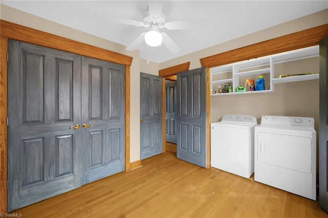 washroom featuring ceiling fan, washing machine and clothes dryer, and light wood-type flooring