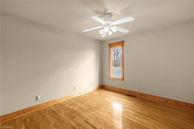 spare room featuring ceiling fan and light wood-type flooring