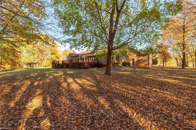 view of yard featuring a wooden deck